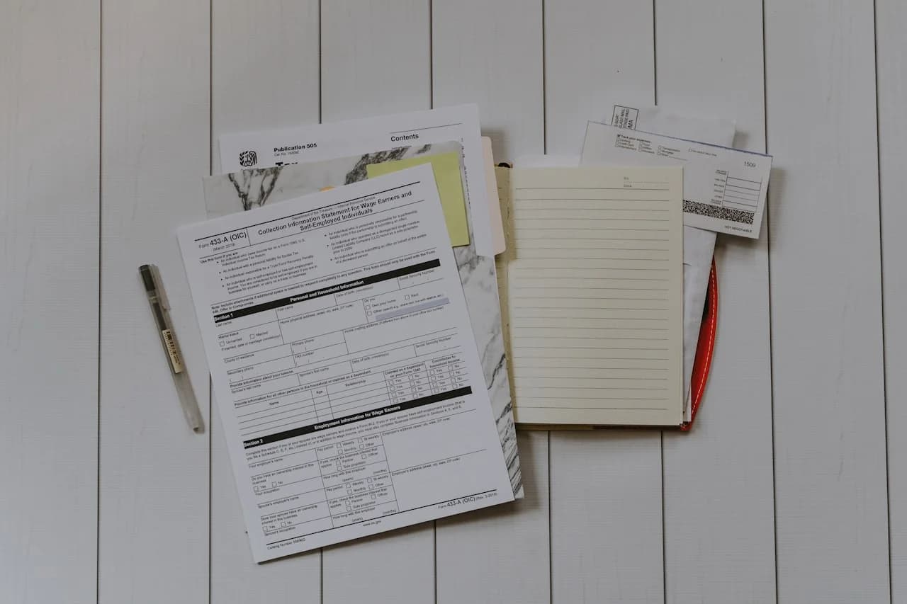 Stack of papers flat lay (Kelly S., Unsplash)