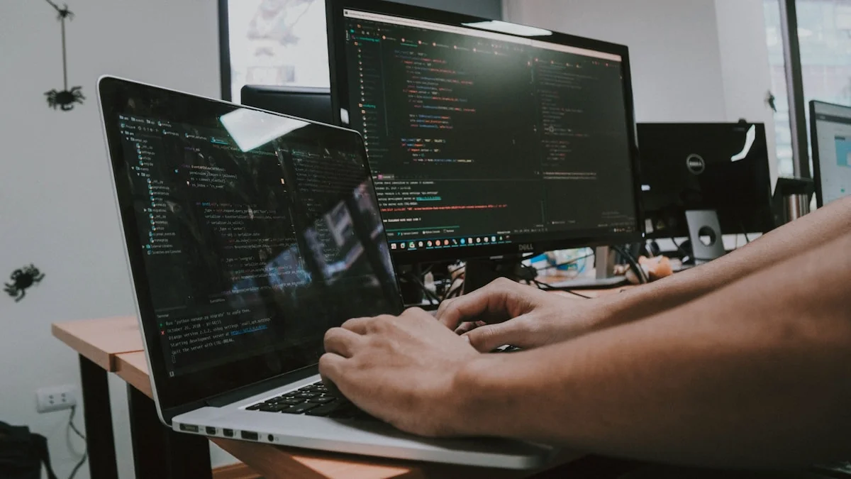 Person typing on a laptop on a desk (Shaming Haky, Unsplash)